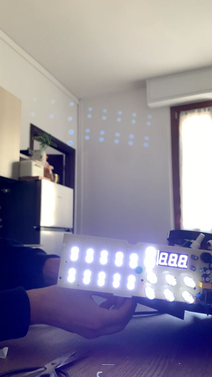 The control board lit up again: the display and all the buttons glowing.